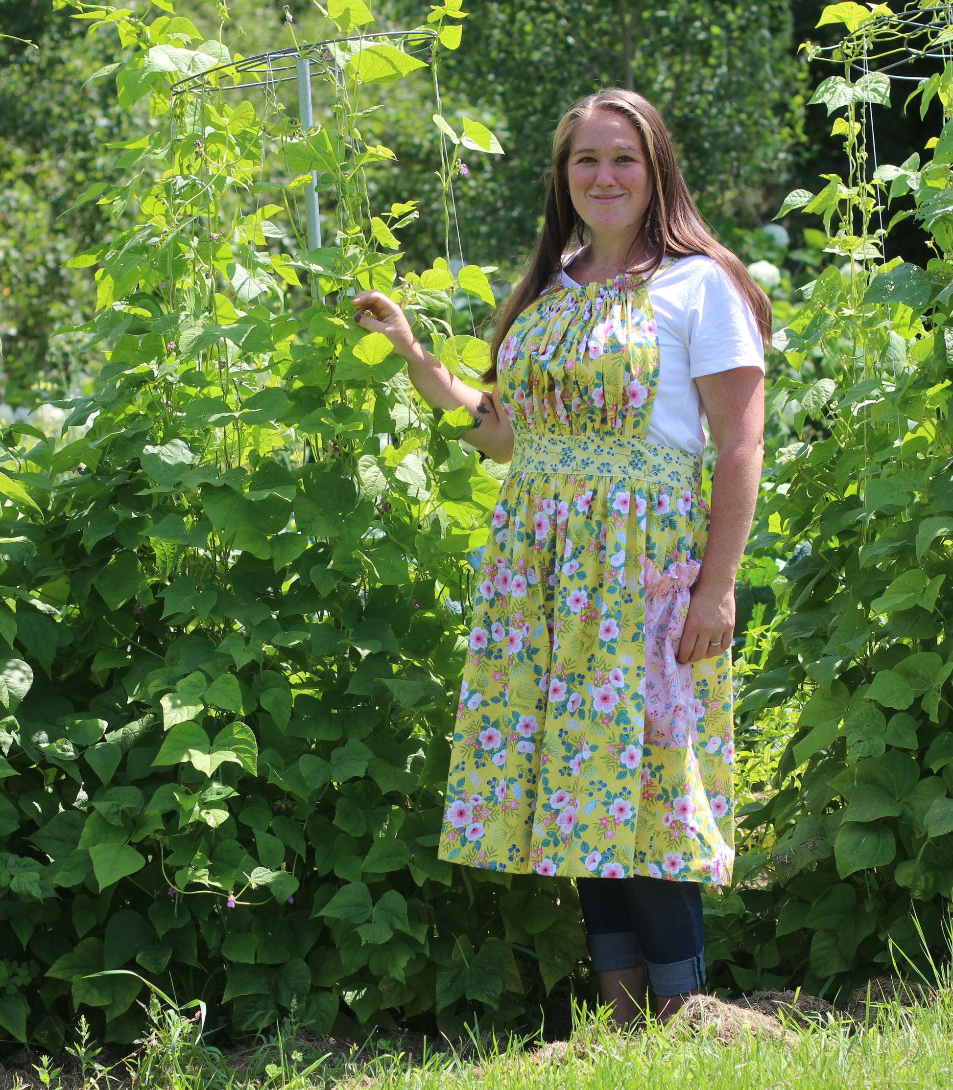 Gathered Bib Apron in Yellow Floral - with tall bean stalks.