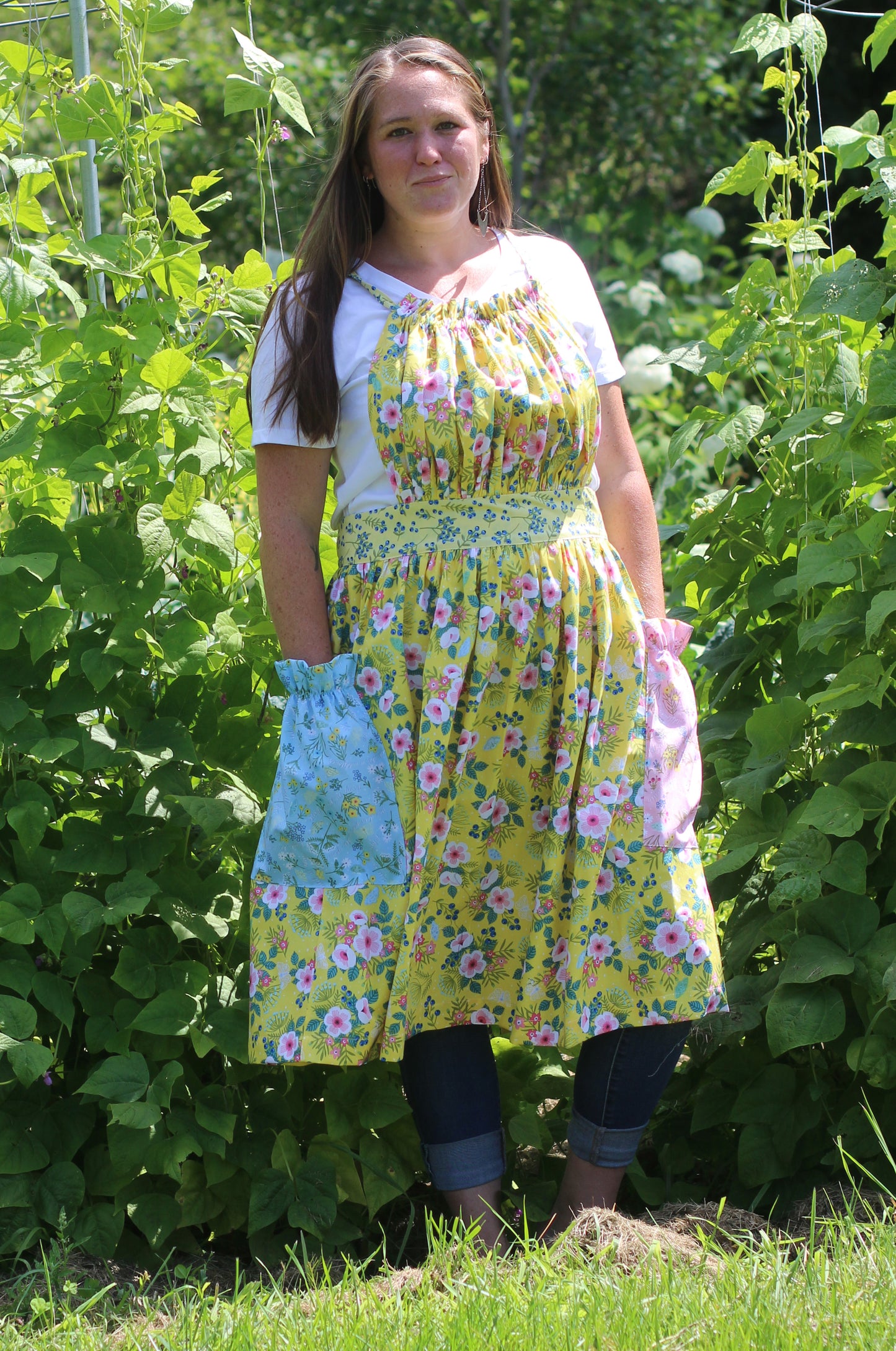 Gathered Bib Apron in Yellow Floral - Showing off the pockets.