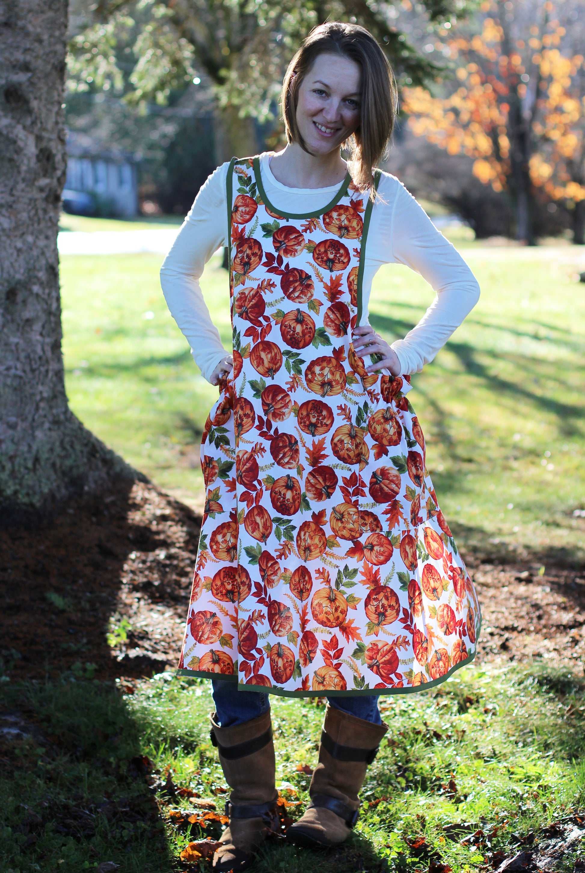 No Ties Apron in a Pumpkin Print - front View with model smiling