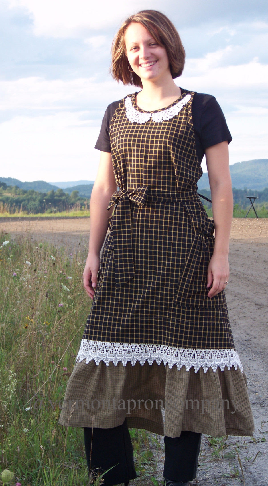 Country Hostess Apron in Black 100% Cotton Homespun with lace trim over a wide ruffled bottom, front view