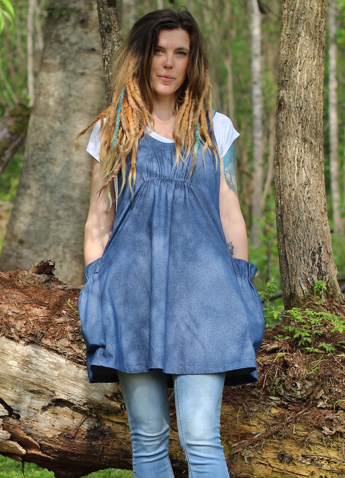 XS-5X Smock #1 in Denim - Front View standing next to a fallen tree.