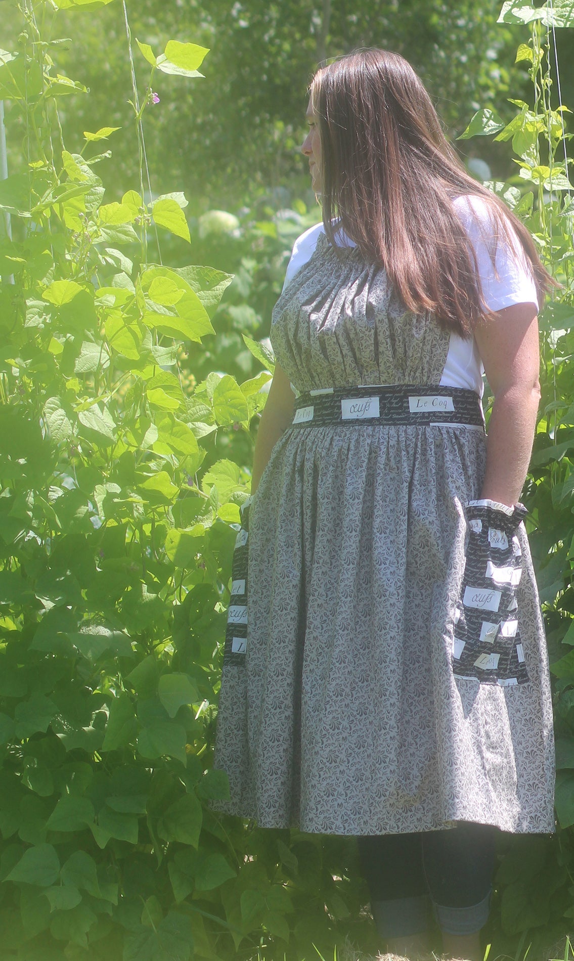 Gathered Bib Apron in Grey Floral - Bow tied in back